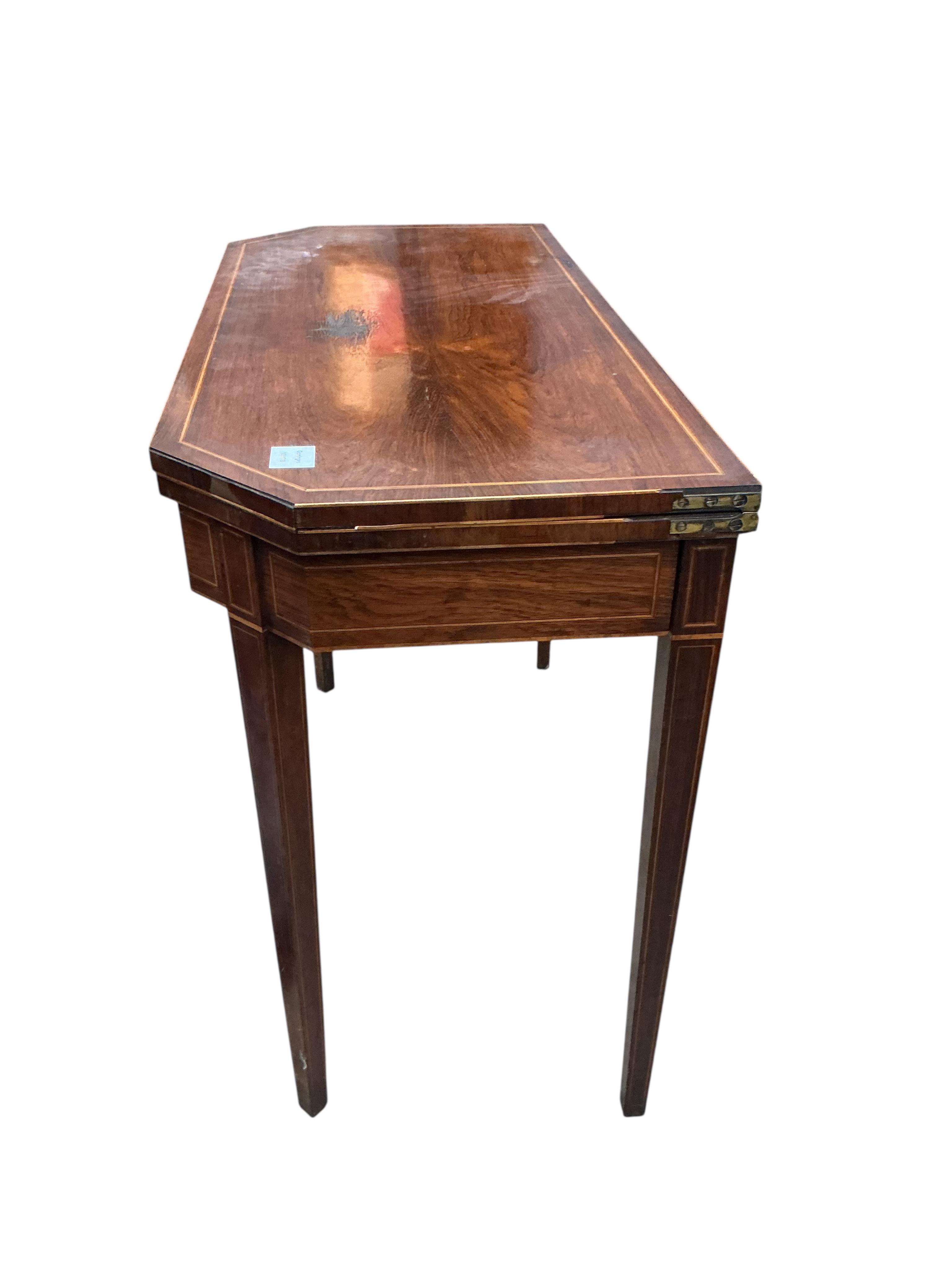 A George III inlaid banded rosewood folding tea table, width 91cm, depth 43cm, height 74cm